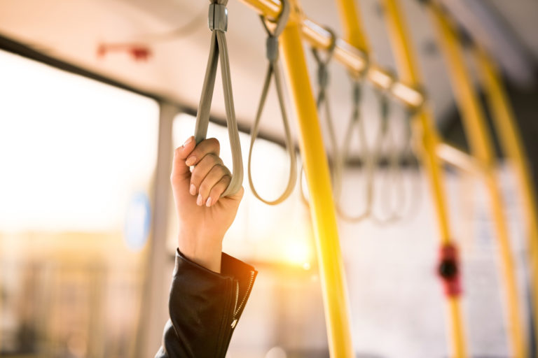 Person standing in bus