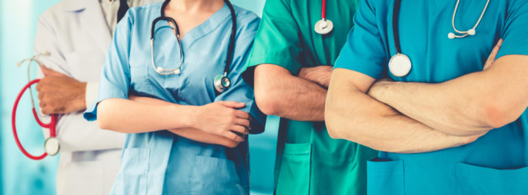 Doctor working in hospital to fight 2019 coronavirus disease or COVID 19. Professional healthcare people with other doctors, nurse and surgeon. Corona virus medical care and protection concept.