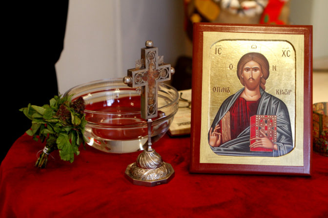 Holy water, painted picture of Crist and a cross