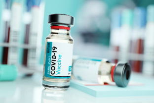 Vial Of Covid 19 Vaccine In A Medical Research Lab