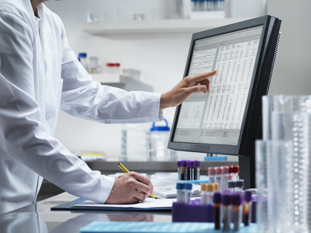 Scientist using computer in lab