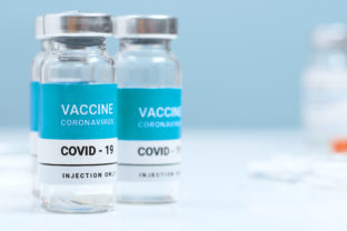 Measles, flu, coronavirus, covid 19 vaccine transparent liquid vials in the laboratory. Testing and creating a new vaccine against the epidemic