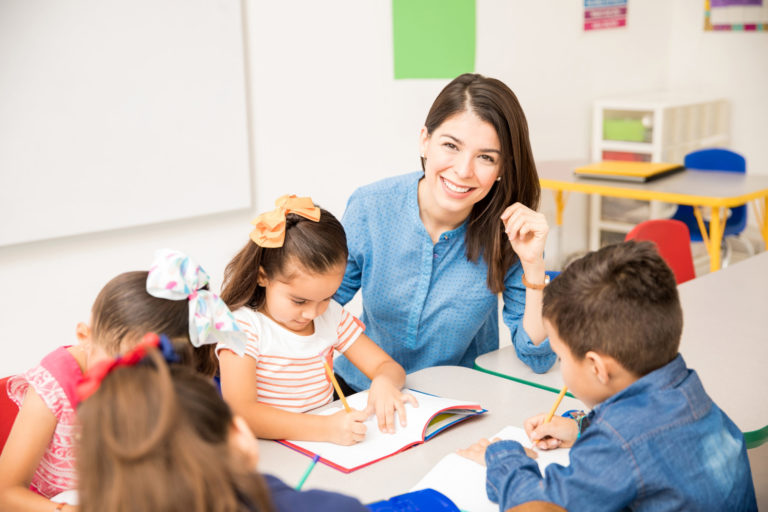 Beautiful preschool teacher during class