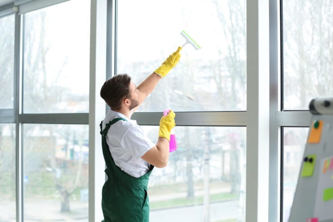 Male,Janitor,Cleaning,Window,In,Office