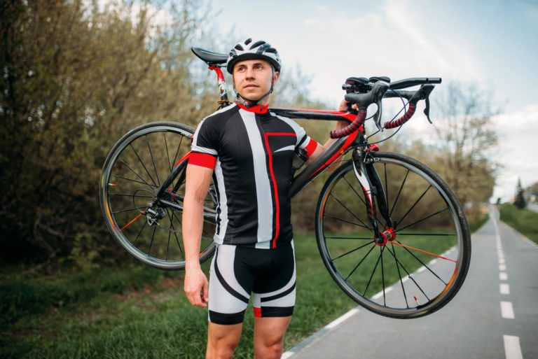 Bycyclist keeps bike shoulder after biking.jpg