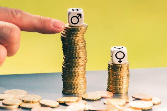 Symbol for unequal payment. Gender symbols on different high stacks of coins.