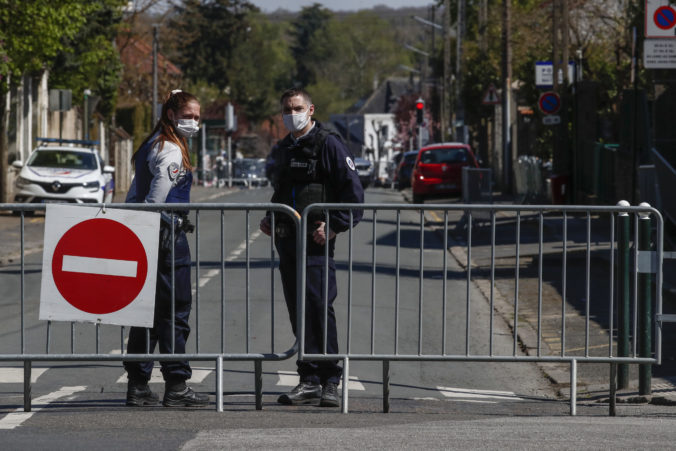 French police officers block the access next to the police station where a police official was stabbed to death Friday in Rambouillet, south west of Paris, Saturday, April 24, 2021. Anti-terrorism Investigators were questioning three people Saturday detained after the deadly knife attack a day earlier on a police official at the entry to her station in the quiet town of Rambouillet, seeking a motive, purported ties to a terrorist group and whether the attacker, killed by police, acted alone. ()