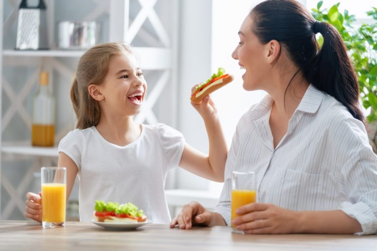 Happy family having breakfast.