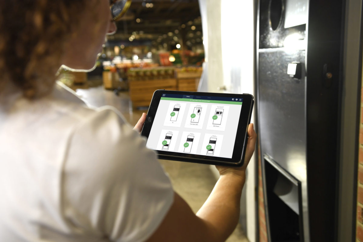 Employee with pad notifyassist.jpg