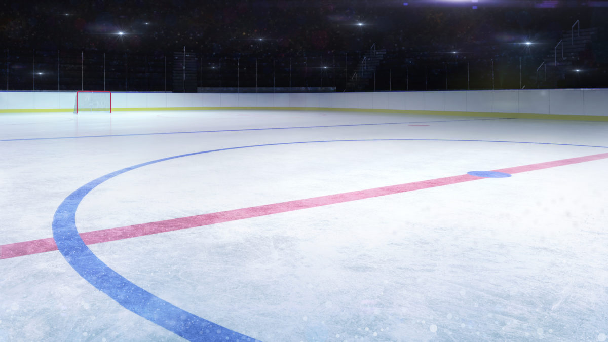 Ice hockey stadium middle rink general view and camera flashes behind
