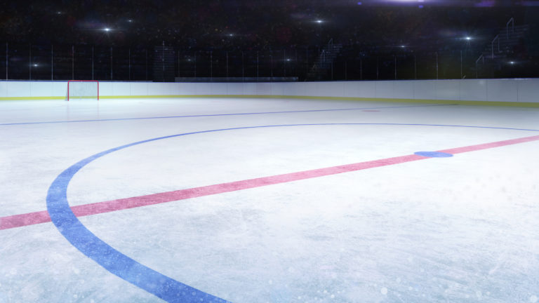 Ice hockey stadium middle rink general view and camera flashes behind