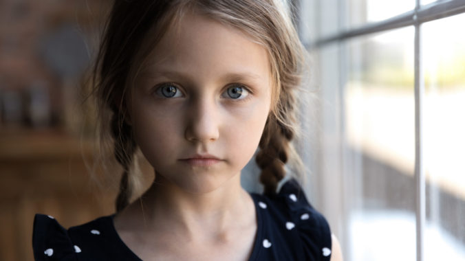 Close up portrait of Caucasian sad little girl