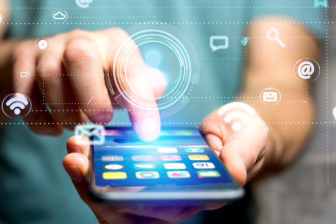 Businessman using a smartphone with a Contact icon surrounding by app and social icon - 3d render