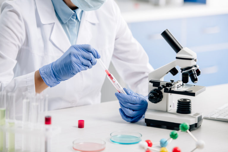 Cropped view of genetic consultant doing dna test in lab
