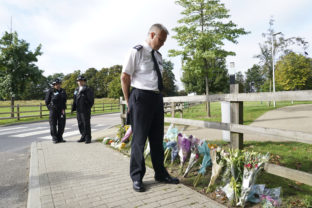 Britain Woman Killed Chief Superintendent Trevor Lawry stands by the floral tributes at Cator Park in Kidbrooke, near to the area where the body of Sabina Nessa was found, in London, Thursday, Sept. 23, 2021. British police investigating the killing of a 28 year old woman in London say they are probing whether she was attacked by a stranger. It's a case that sparked new concerns for the safety of women walking the capital’s streets. Police called for information over the murder of a primary school teacher Sabina Nessa on Sept.17 in southeast London. Detectives believe she was attacked during what would have been a five minute walk through a local park on her way to meet a friend at the pub. The case came just a few months after the abduction, rape and murder of 33 year old Sarah Everard in south London by a serving police officer. London Mayor Sadiq Khan described the violence against women as a national “epidemic.” ()