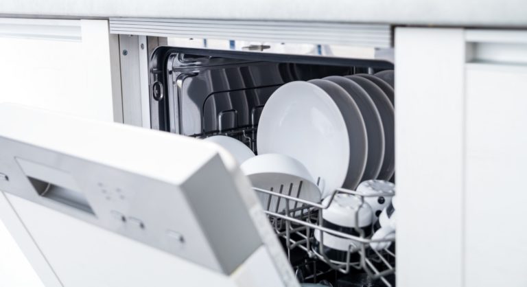 Open dishwasher with clean dishes