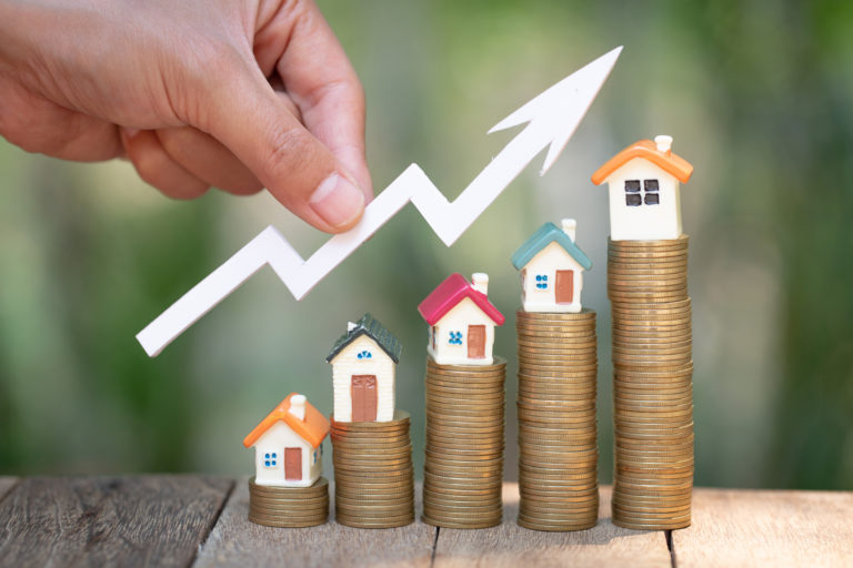 Planning savings money of coins to buy a home, concept for property ladder, mortgage and real estate investment. for saving or investment for a house, growing business