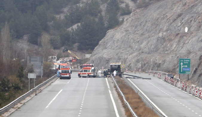 Bulgaria Bus Crash Firefighters and forensic workers inspect the scene of a bus crash on a highway near the village of Bosnek, western Bulgaria, Tuesday, Nov. 23, 2021. A bus carrying tourists back to North Macedonia crashed and caught fire in western Bulgaria early Tuesday, killing at least 45 people, including a dozen children, authorities said.