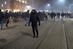 Virus Outbreak Netherlands In this image taken from video, demonstrators protest against government restrictions due to the coronavirus pandemic, Friday, Nov. 19, 2021, in Rotterdam, Netherlands. Police fired warning shots, injuring an unknown number of people, as riots broke out Friday night in downtown Rotterdam at a demonstration against plans by the government to restrict access for unvaccinated people to some venues.