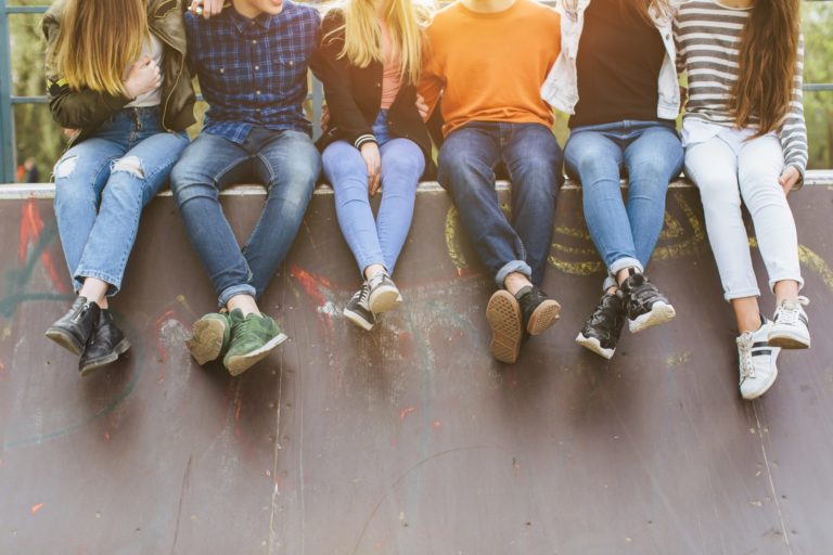Summer holidays and teenage concept - group of smiling teenagers