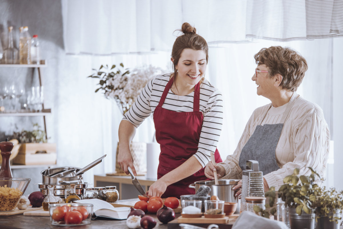 Women in kitchen aprons
