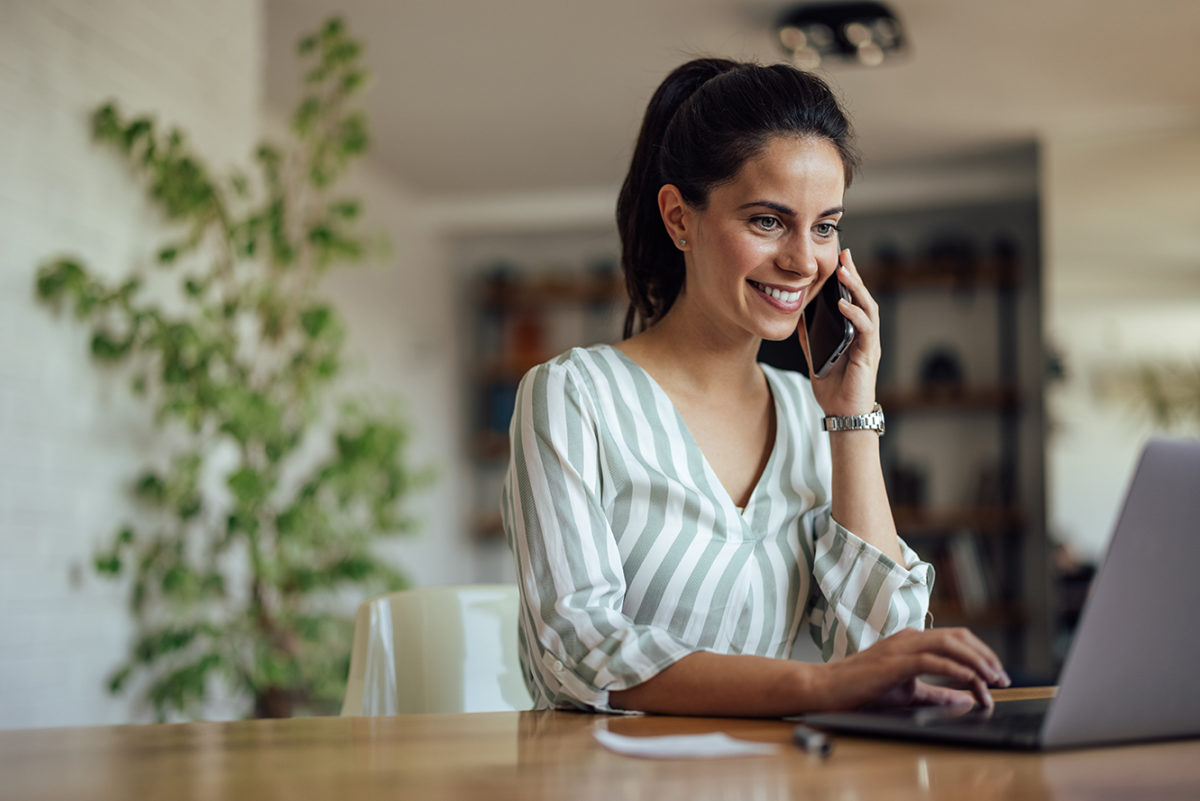 Cheerful caucasian woman, talking to a client