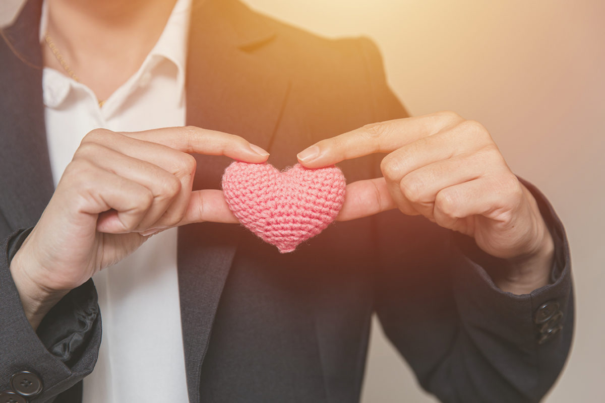 Business employee with heart for customer care relationship mana