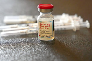 A vial filled with the Moderna COVID-19 vaccine rests by syringes waiting to be loaded by nurses from the Jackson-Hinds Comprehensive Health Center, at a vaccination station next to Jackson State University in Jackson, Miss., Tuesday, Dec. 7, 2021. More than 1,419,000 people have now been fully vaccinated against COVID-19 in Mississippi, and according to the Mississippi State Department of Health, most COVID-19 cases, hospitalizations and deaths are now among unvaccinated Mississippians. ()
