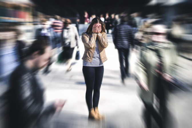 Panic attack in public place. Woman having panic disorder in city. Psychology, solitude, fear or mental health problems concept.