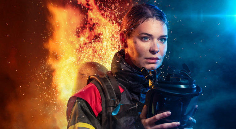 Female firefighter after work with a mask and a self contained breathing apparatus