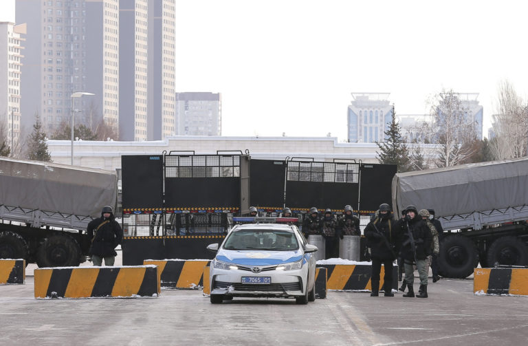 Kazakhstan Protests Police block the road towards the center of Nur Sultan, Kazakhstan, Thursday, Jan. 6, 2022. Kazakhstan's president authorized security forces on Friday to shoot to kill those participating in unrest, opening the door for a dramatic escalation in a crackdown on anti government protests that have turned violent. The Central Asian nation this week experienced its worst street protests since gaining independence from the Soviet Union three decades ago, and dozens have been killed in the tumult.
