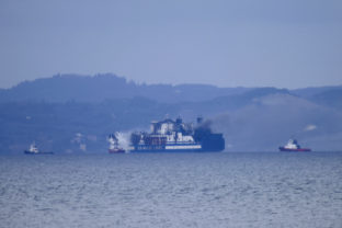 Albania Greece Smoke rises from the Italy flagged Euroferry Olympia as it burns for a third day at the Ionian Sea, as it is seen from Albania's southwestern Saranda town, Sunday, Feb. 20, 2022. Rescue teams in Greece searched a burning ferry Saturday for a dozen of people believed to be missing after it caught fire in the Ionian Sea while en route to Italy, while passengers described a frightening evacuation from the ship.  Ferry Fire