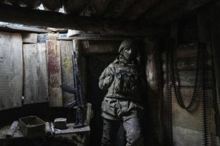 APTOPIX Ukraine A Ukrainian serviceman stands in a shelter on a position at the line of separation between Ukraine held territory and rebel held territory near Zolote, Ukraine, Saturday, Feb. 19, 2022. Ukrainian President Volodymyr Zelenskyy, facing a sharp spike in violence in and around territory held by Russia backed rebels and increasingly dire warnings that Russia plans to invade, has called for Russian President Vladimir Putin to meet him and seek a resolution to the crisis.  Tensions