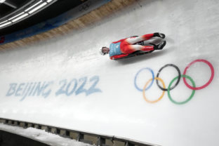 Beijing Olympics Luge Mateusz Sochowicz of Poland speeds past the Olympic rings during a men's luge training run at the 2022 Winter Olympics, Wednesday, Feb. 2, 2022, in the Yanqing district of Beijing.
