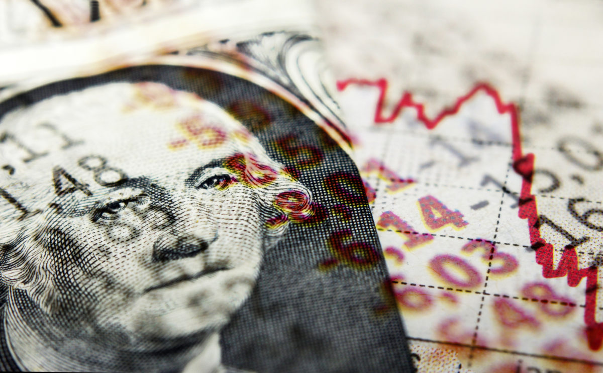 Dollar bill and Covid 19 newspaper headlines