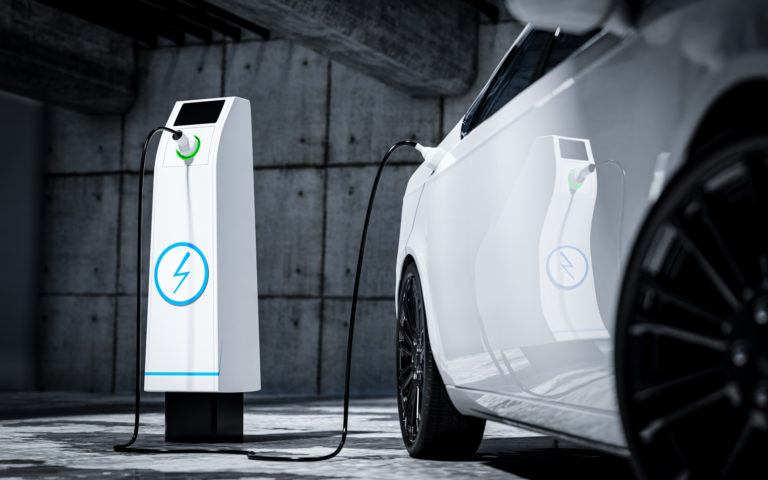 Charging an electric car with a public charger in a parking lot