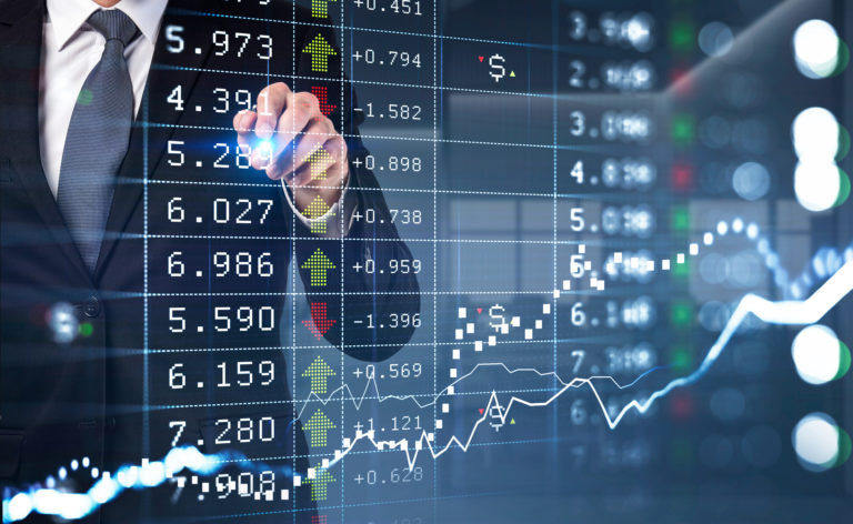 Businessman in formal suit is touching a financial chart