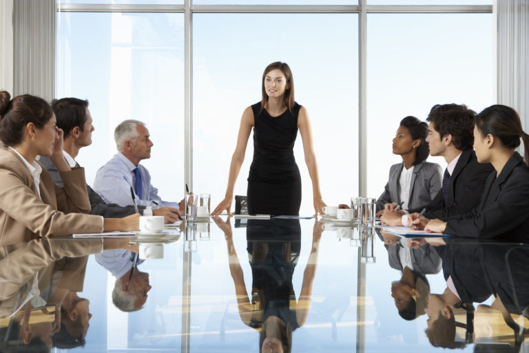 Group Of Business People Having Board Meeting