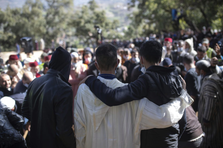 Morocco Boy Trapped The father of 5 year old Rayan, center, is consoled by relatives as he attends his funeral after his body was retrieved from a deep well, in the village of Ighran in Morocco's Chefchaouen province, Monday, Feb. 7, 2022. Five year old Rayan was pulled dead from a 32 meter (105 foot) deep dry well where he was trapped for five days.