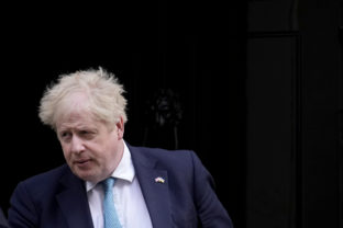 APTOPIX Britain Politics British Prime Minister Boris Johnson leaves 10 Downing Street to attend the weekly Prime Minister's Questions at the Houses of Parliament, in London