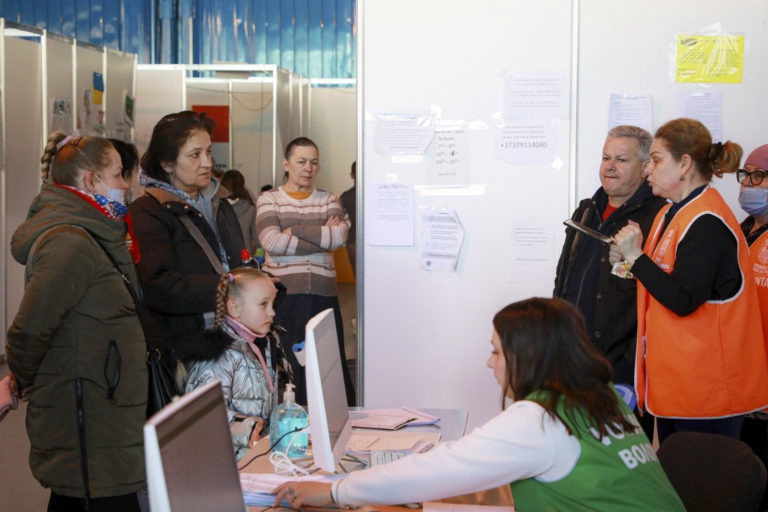 Moldova Russia Ukraine War Volunteers talk to refugees fleeing the war in Ukraine in a refugee center, in Chisinau, Moldova