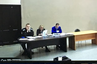 Russia Navalny In this image provided by the Russian Federal Penitentiary Service, Russian opposition leader Alexei Navalny, left, is seen via a video link, sitting next to his layers during a court session in Pokrov, Vladimir region, about 100 kilometers (62 miles) east of Moscow, Russia, Tuesday, March 15, 2022. The Russian authorities are seeking a 13 year prison sentence for opposition leader Alexei Navalny in a trial that is widely seen as politically motivated