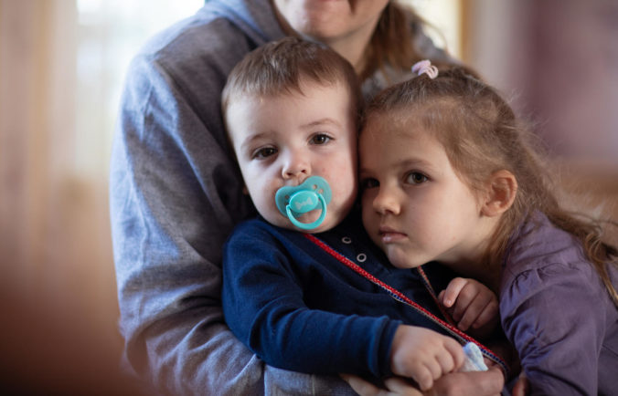 Anna (4) and Trofym (1) with their parents and elder brother were forced to flee their home in a non government controlled area in eastern Ukraine, when a missile rocket hit their house. A displaced family with three children is now renting a house with n