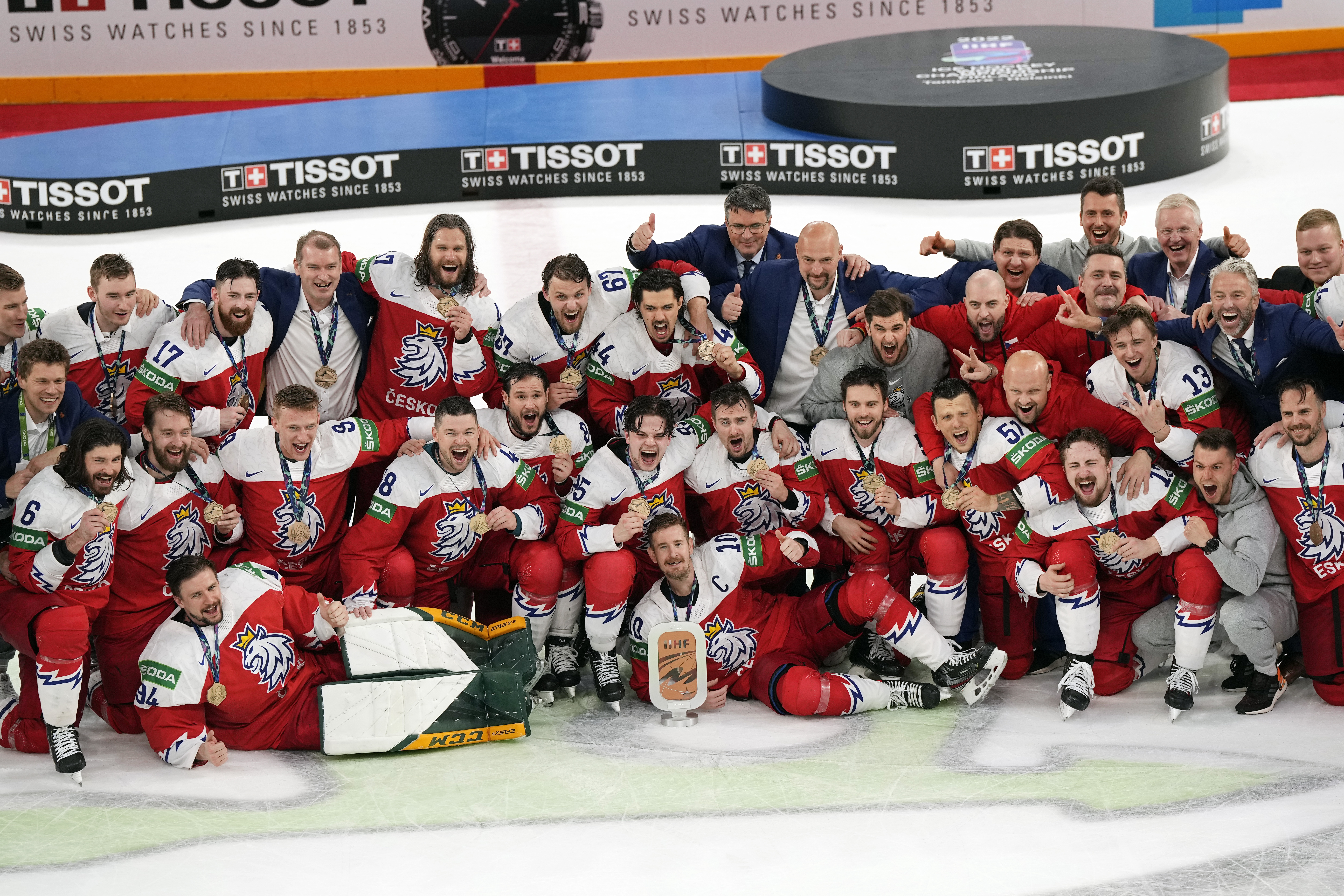 The Czech Republic team poses for a photo while holding the Bronze medal trophy after the Hockey World Championship bronze medal match between Czech Republic and USA in Tampere, Finland, on Sunday, May 29, 2022. The Czech Republic won 8-4