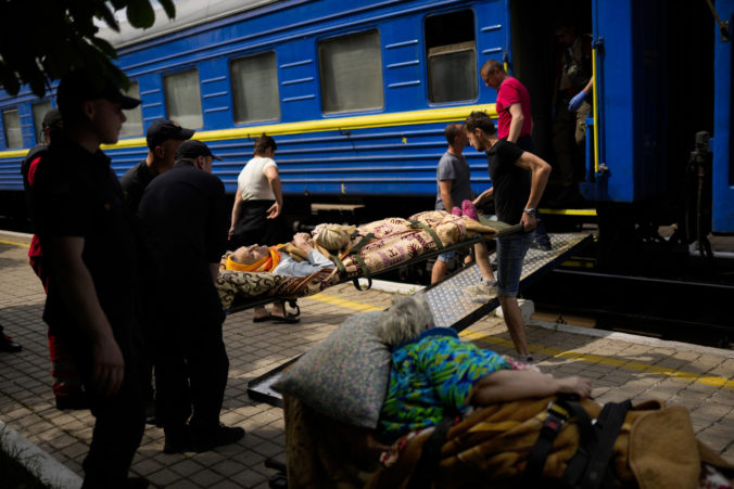 Patients board a medical evacuation train run by MSF (Doctors Without Borders) at the train station in Pokrovsk, eastern Ukraine, Sunday, May 29, 2022. The train is specially equipped and staffed with medical personnel, and ferries patients from overwhelmed hospitals near the front line, to medical facilities in western Ukraine, far from the fighting.