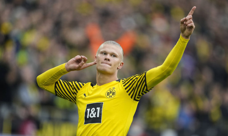 FILE - Dortmund's Erling Haaland celebrates after scoring a penalty during the German Bundesliga soccer match between Borussia Dortmund and FSV Mainz 05 in Dortmund, Germany, Saturday, Oct. 16, 2021. Erling Haaland looks sure to be coming home. The future of the Norway striker is set to be finalized this week and the expectation is he will leave Borussia Dortmund to join Manchester City as the English club’s belated replacement for Sergio Aguero. The 21-year-old Haaland is one of the rising stars of world soccer.