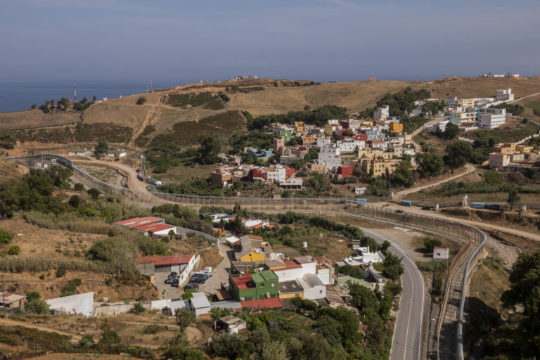 FILE - View of the border fence that separates Spain, left, and Morocco, right, as seen from the Spanish enclave of Ceuta, Thursday, June 3, 2021. The land borders between Morocco and Spain's North African enclaves of Ceuta and Melilla will reopen next week, Spain said Thursday, May 11, 2022, after being closed for more than two years due to COVID-19 restrictions and tensions between the two countries. ()