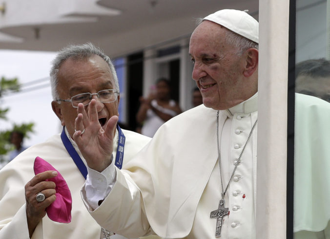 FILE - Small drops of blood stain Pope Francis' white cassock as he speaks with Jorge Enrique Jimenez Carvajal, emeritus archbishop of Cartagena after knocking his face next to his eye on the popemobile in Cartagena, Colombia, Sunday, Sept. 10, 2017. Pope Francis said Sunday, May 29, 2022 he has tapped 21 churchmen to become cardinals, most of them from continents other than Europe, which has dominated Catholic hierarchy for most of the church's history. (AP Photo/Andrew Medichini, File)