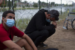 Migrants from Cuba rest after crossing the Rio Grande river in Eagle Pass, Texas, Sunday May 22, 2022. Little has changed in what has quickly become one of the busiest corridors for illegal border crossings since a federal judge blocked pandemic-related limits on seeking asylum from ending Monday.