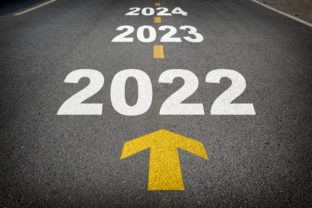 New year 2022 to 2024 and yellow arrow on asphalt road